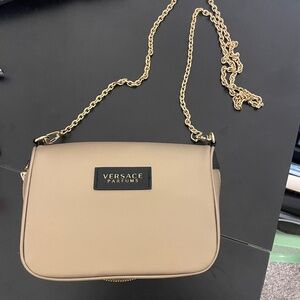 Versace purse, keychain, and socks